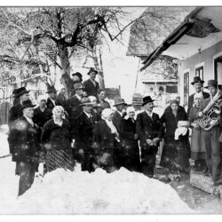 Arrival of wedding guests at the groom's home and a ritual where groom's mother is handing over the keys and a ritual bread to her daughter-in-law. Kadunc's wedding, Ter, before the Second World War (Property of Jože Brgles, vulgo Kogovnik)